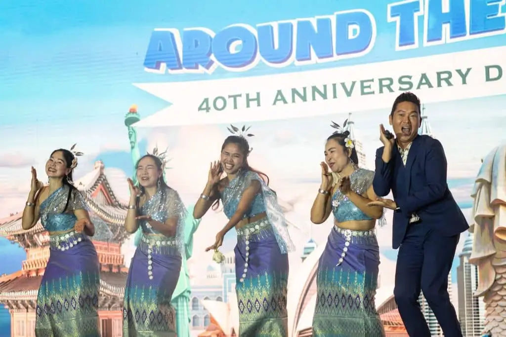 James Yang hosting a live anniversary dinner event on stage